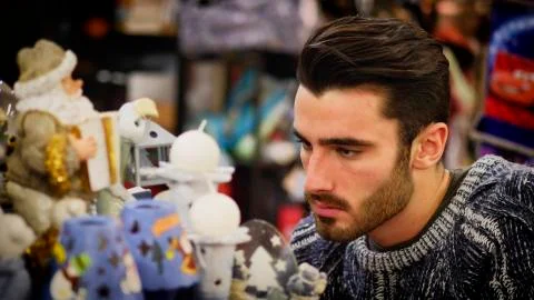Man looking at goods on shelf Stock Photos
