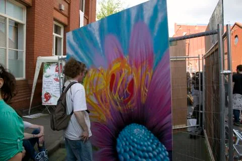 Man looking at graffiti artwork. Stock Photos
