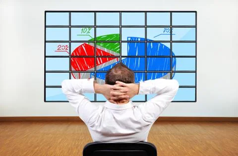Man looking at graphic Stock Photos