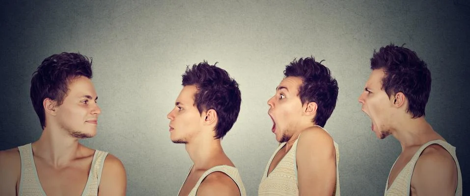 Man looking at himself expressing different emotions calm, shock, anger Foto stock
