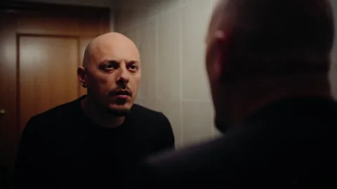 Man Looking at Himself in the Mirror Stock Footage 297991285