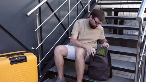 A man is looking for his documents before traveling Stock Footage 273070673