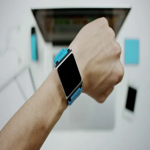 Man looking at his electronic watch Stock Footage 69633463