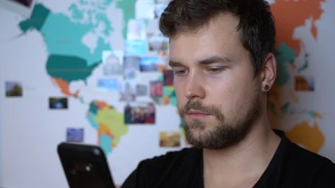 A man looking in to his phone. Stock-Footage 124090719