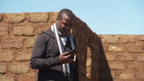 A Man Looking at His Phone Stock Footage 303794501