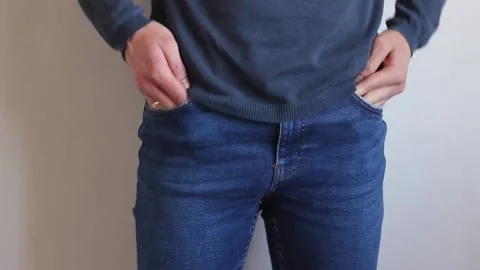 Man is looking in his pockets for something and finds nothing. Stock Footage 130638475