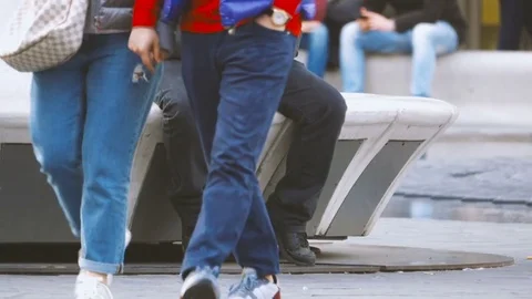 Man Looking at His Smartphone While Sitting in a City Square Stock Footage 73729266