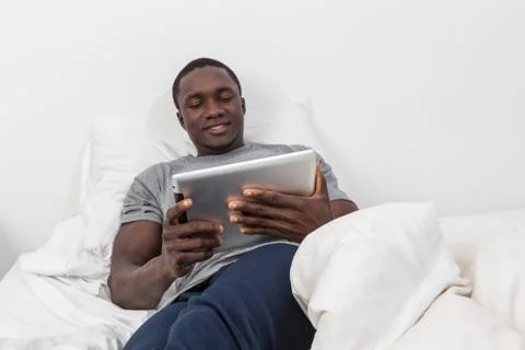 Man looking at his tablet. Stock-Fotos