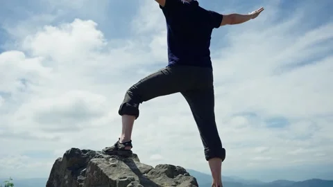 Man looking at the horizon using binoculars in the mountain. Stock Footage 280334905