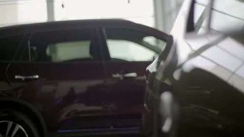 Man is looking how the car is painted. Stock Footage 92661270