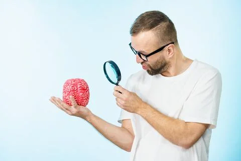Man looking at human brain Stock Photos
