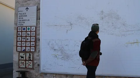 Man looking at the Hvar city map on the wall Video stock 41871006