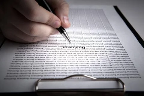 Man is looking for information in the in the document Stock Photos