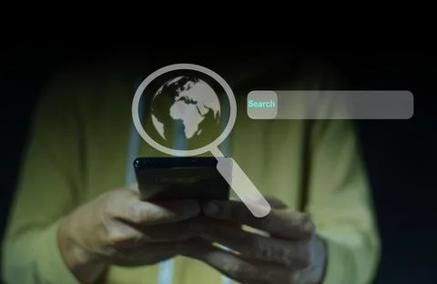 Man looking for information on the internet Through mobile phones to find v.. Stock Photos