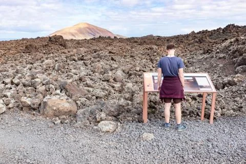 A man looking on informationa panel on beautiful trek to vulcano Caldera Blan Stock Photos