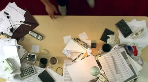 A man looking for keys on a messy desk Video stock 11303242