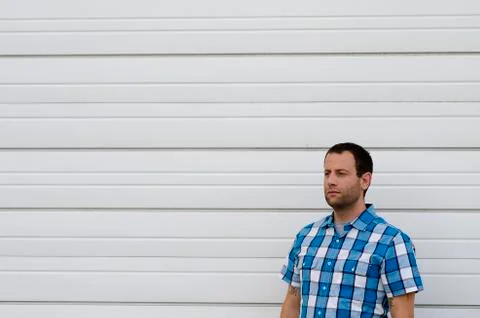 Man looking to the left alone against a white background. Stock Photos