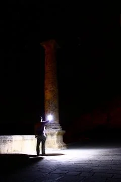 Man looking with light to monument Stock Photos