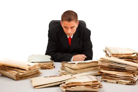 Man looking at lots of documents Stock Photos