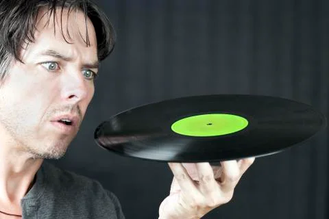 Man looking at lp Stock Photos