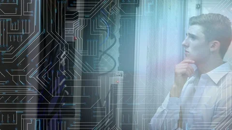 Man looking at mainframe computer in a server room Video stock 112910290