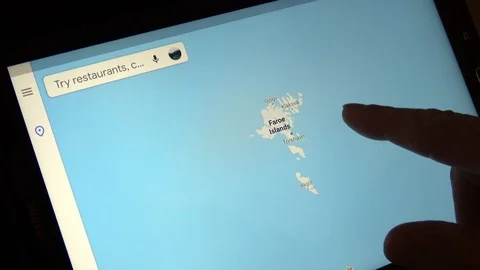 Man Looking At Map Of The Faroe Islands On Tablet Computer Stock Footage 114654703