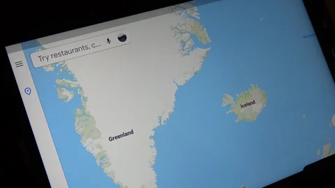 Man Looking At Map Of Iceland On Tablet Computer Stock Footage 114654941