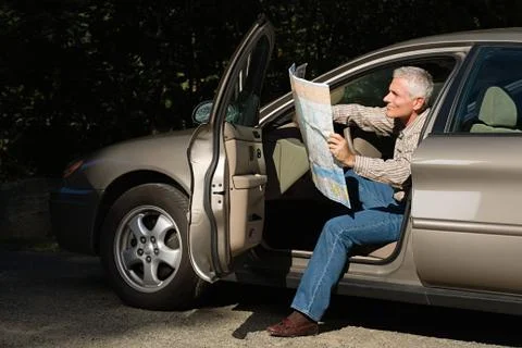 Man looking at map Stock Photos