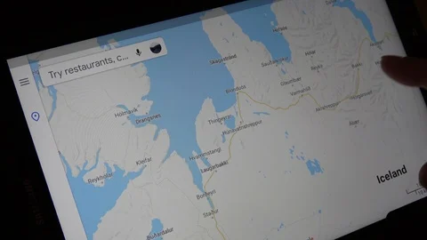 Man Looking At Map Of The Town Akureyri On Tablet Computer Stock Footage 114655149