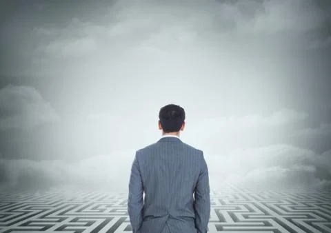 Man looking at a maze with clouds 3d Stock Photos
