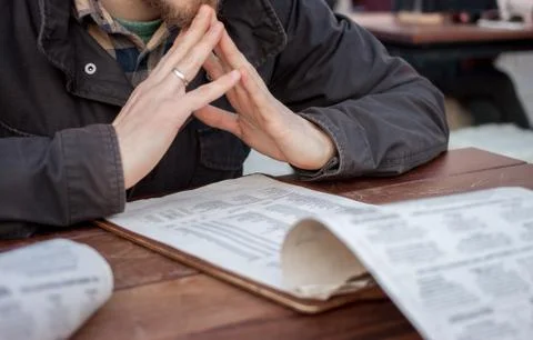 Man looking at menu Stock Photos