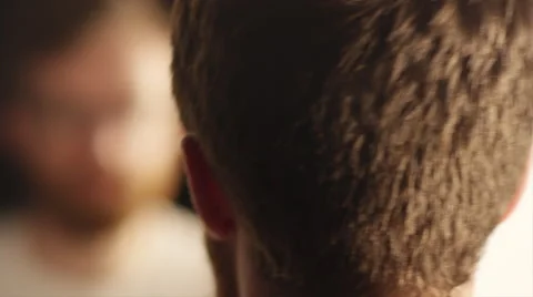 Man looking in a mirror Video stock 51909576