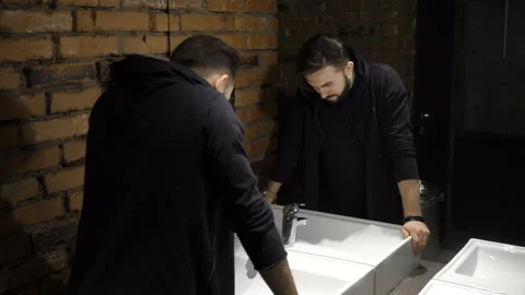 Man is looking in the mirror Stock Footage 86257191