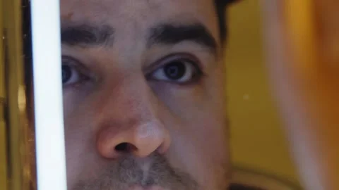 Man looking in mirror Stock Footage 168477527