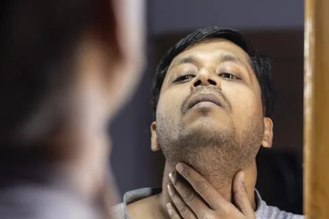 Man looking at mirror Stock Photos