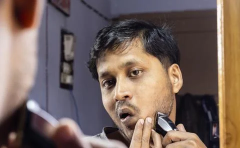 Man looking at mirror Stock Photos