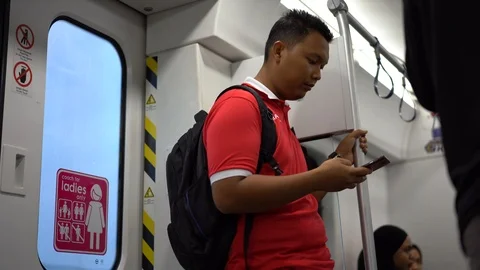The man looking at the mobile phone while in train Video stock 110916313