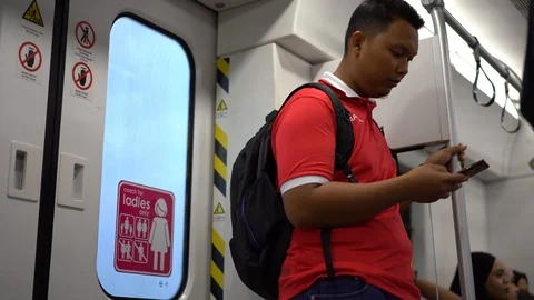The man looking at the mobile phone while in train Video stock 110919149