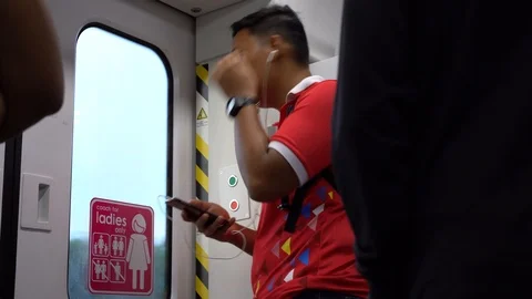 The man looking at the mobile phone while in train Video stock 110924786
