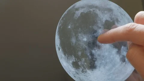 A man looking at the moon on a screen Stock Footage 102943805