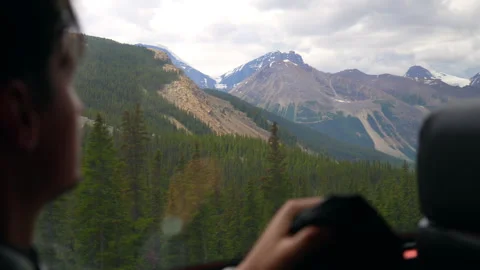 Man Looking at Mountain View From Bus Window, Jasper Stock Footage 328270885