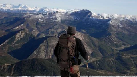 Man looking at the mountains Stock Photos