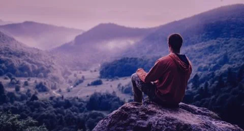 Man looking at mountains Stock Photos
