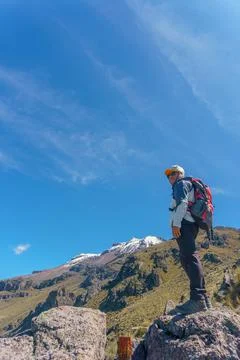 Man looking at the mountains Stock Photos