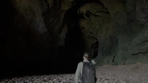 Man Looking at Nam Non Cave's Interior 動画素材 333355588