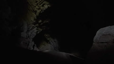 Man Looking at Nam Non Cave's Interior 動画素材 333355637