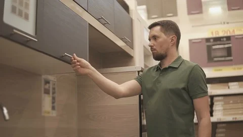 Man looking for new kitchen set. Stock Footage 91446058