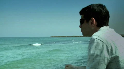 A man looking at the ocean 2 Stock Footage 462639