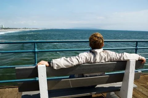 Man looking at ocean Stock Photos