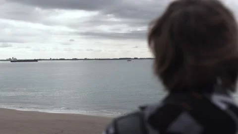 Man Looking At The Ocean In Vlissingen Stock Footage 130676869